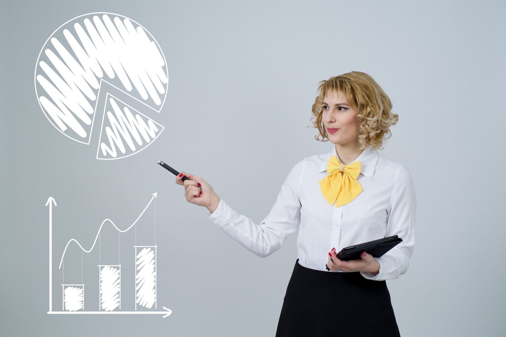 Woman in white shirt showing analytics, pie graph and bar/line graph
