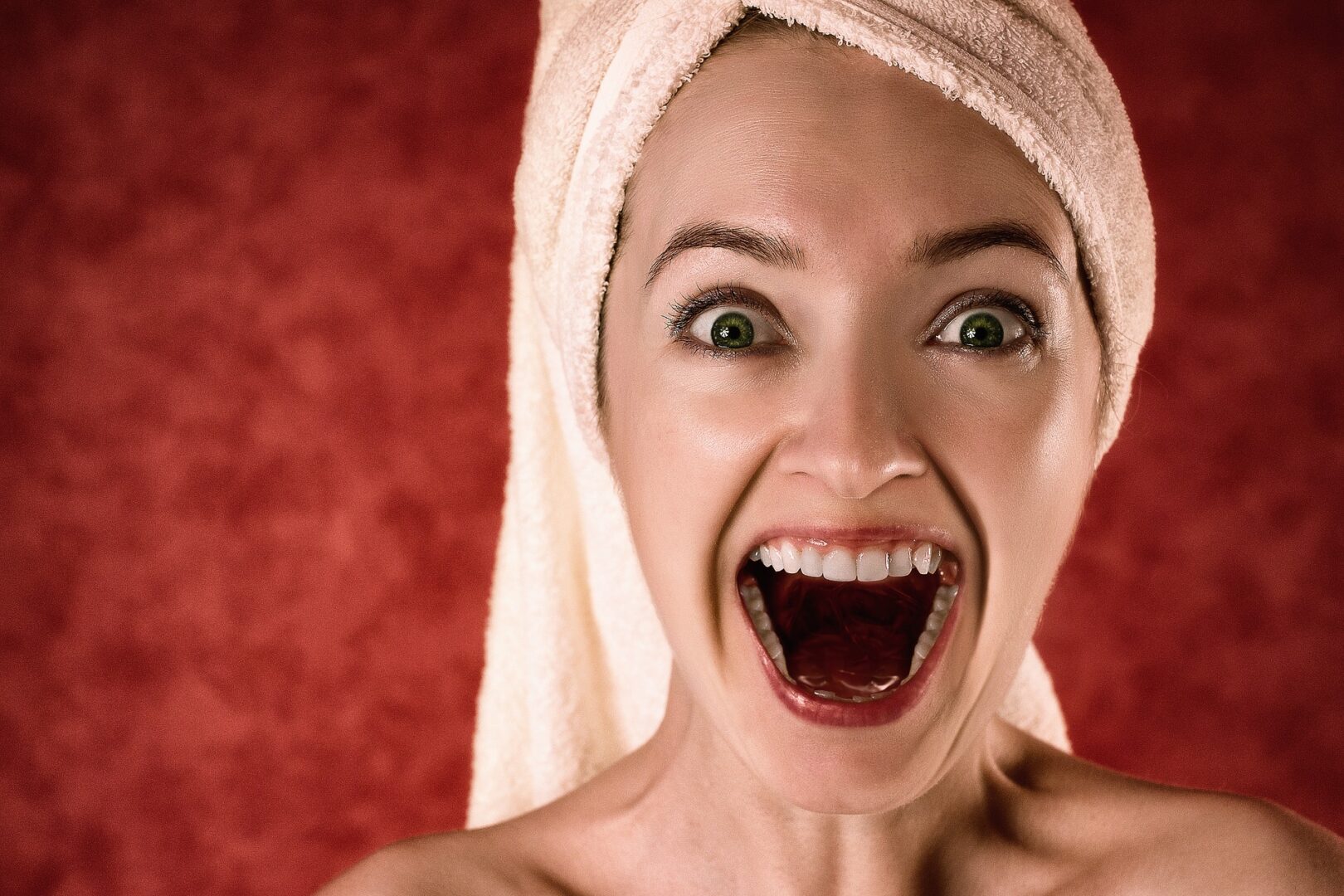 Woman with towel on her head screeming