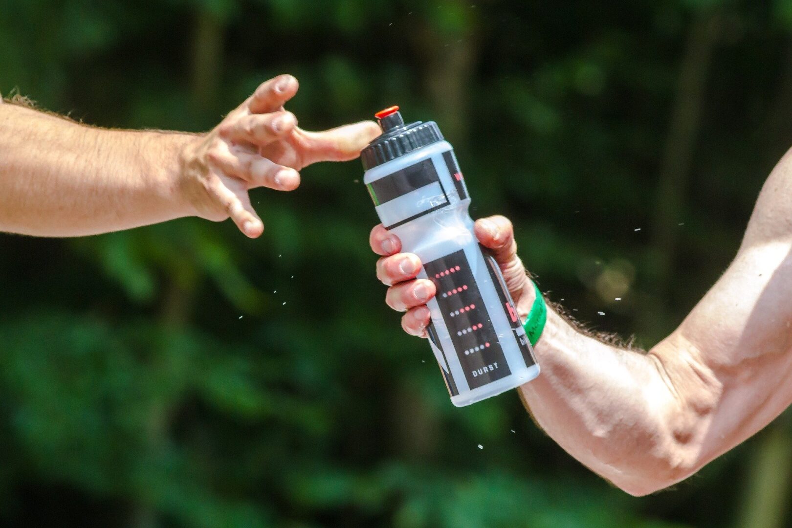 Person grabbing a water bottle