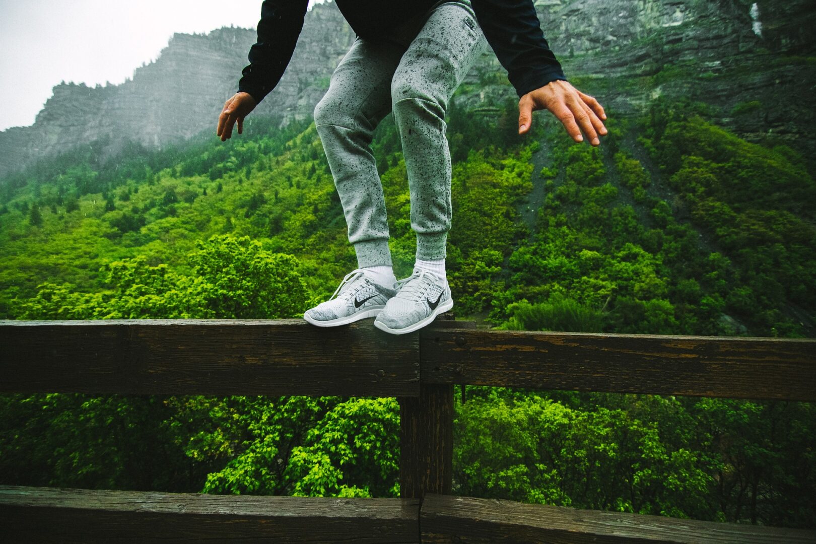 Person balancing on a railing
